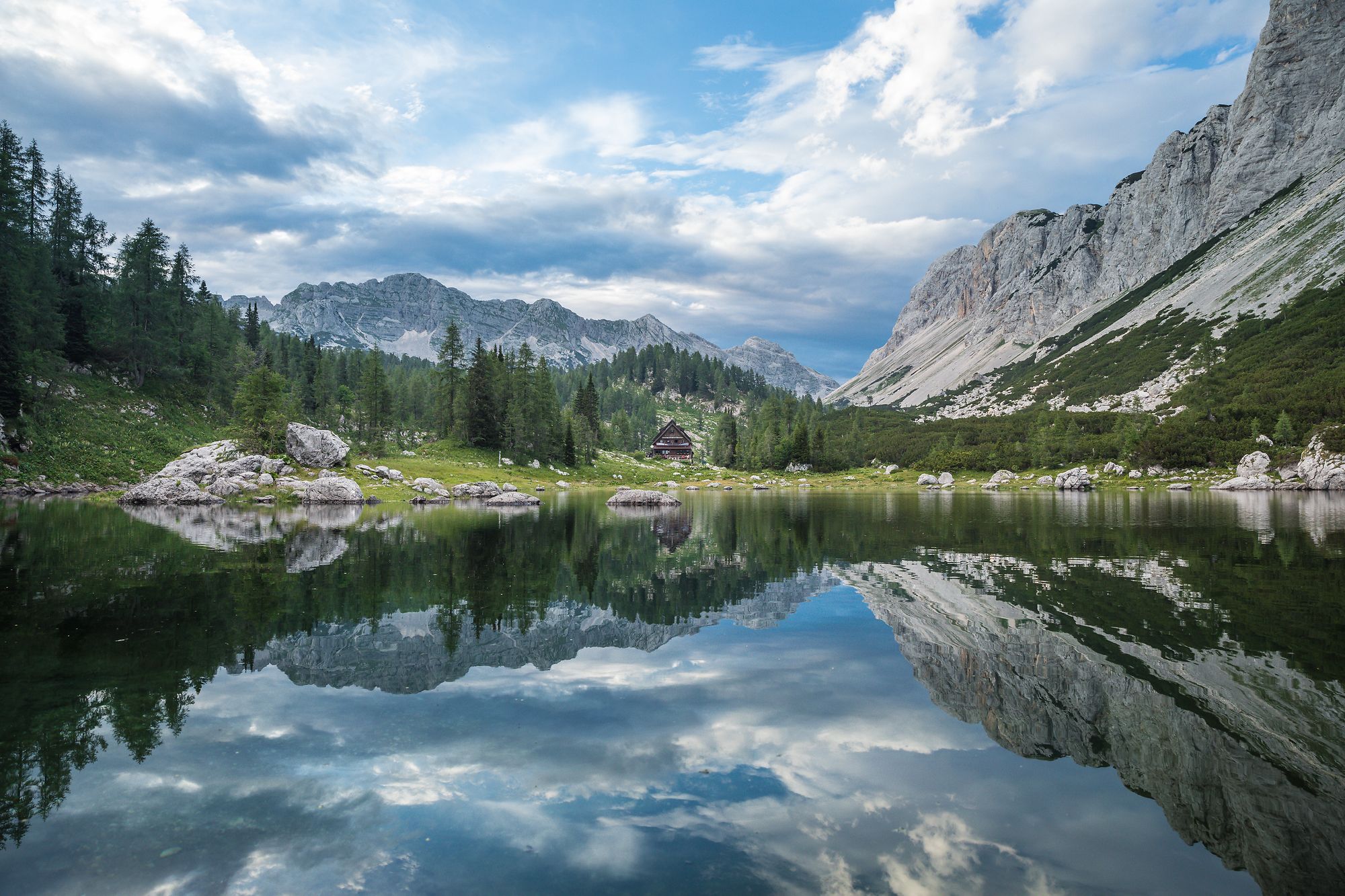 Triglav National Park with a lake, surrounded by unspoiled nature.