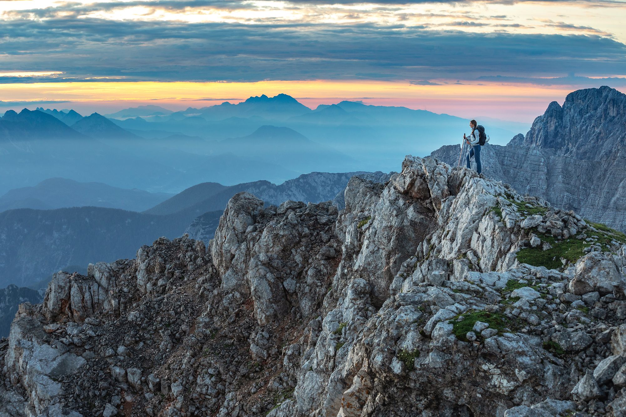  A hiker on the top of a mountain, Julian Alps.