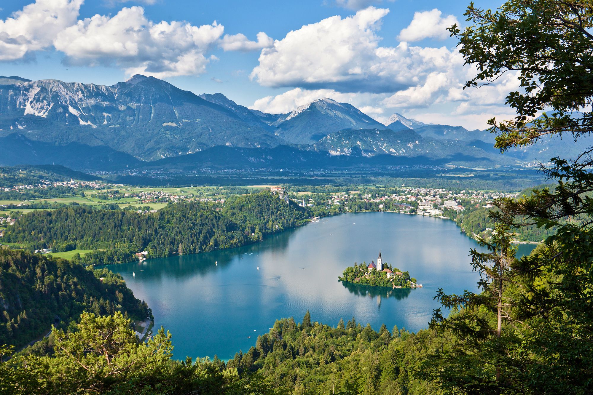 Lake Bled with an island in the middle, and mountains in the background.