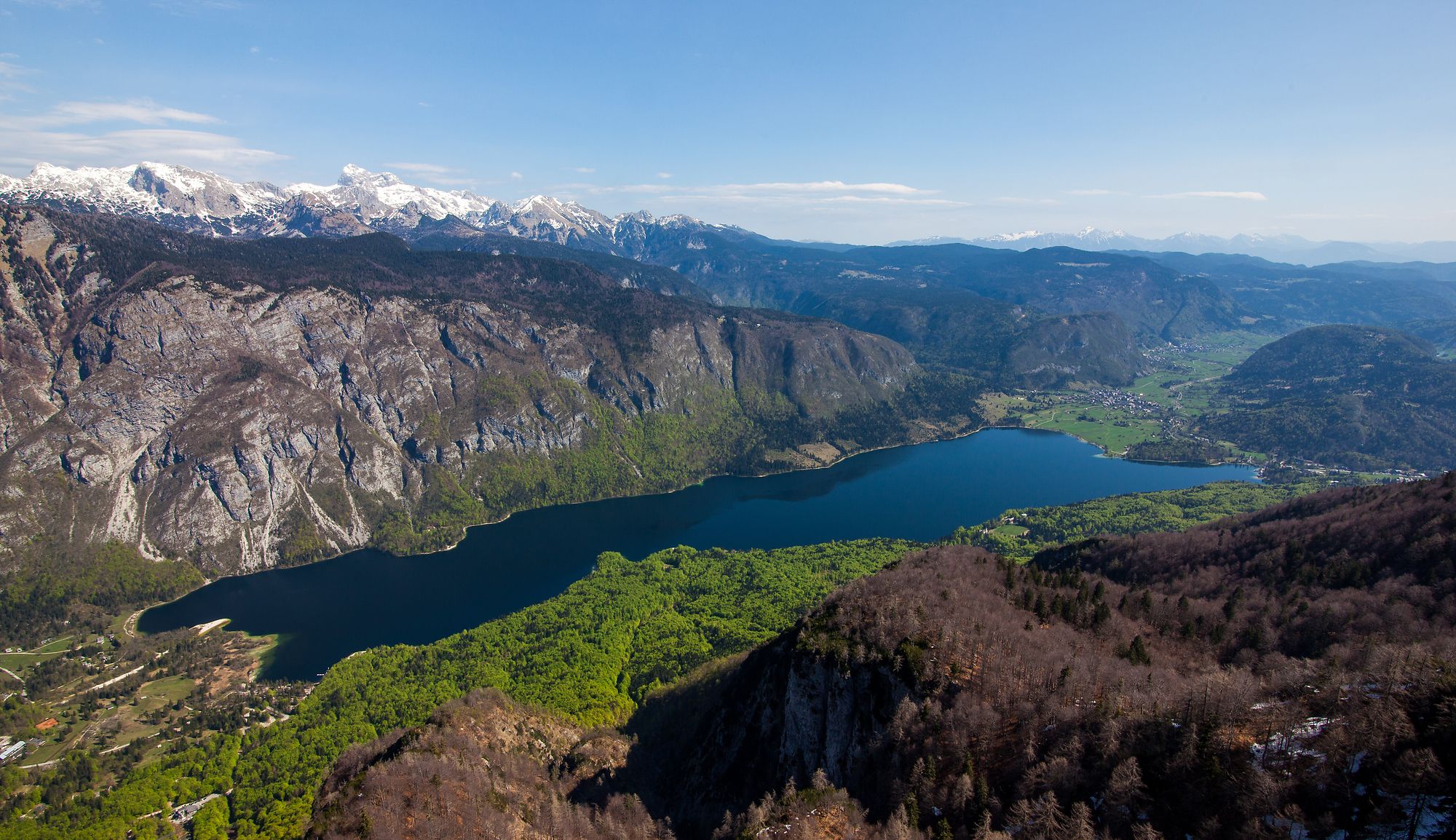 Lake Bohinj surrounded by mountains.